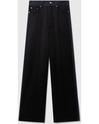 Stella McCartney - Wide-Leg Satin-Panel Denim Jeans - Lyst