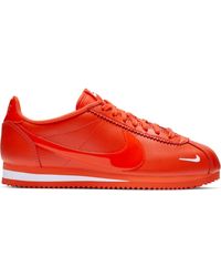 nike cortez orange and black