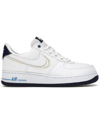 nike air force 1 trainers with navy swoosh and gum sole