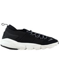 cdg black nike footscape