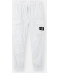 Stone Island - Logo Patch Tapered Leg Trousers - Lyst