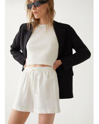Stories Relaxed Linen Shorts in Beige 