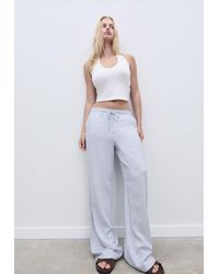 Stradivarius - Pantaloni Lunghi Fluidi A Righe - Lyst