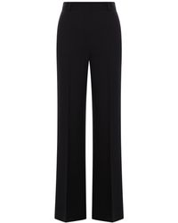 TOTEME - Pantaloni flare in viscosa e lana vergine - Lyst
