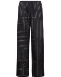 TOTEME - Pantaloni in seta con monogramma - Lyst