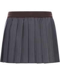 Miu Miu - Minigonna in gessato plissÉ - Lyst