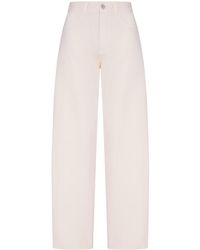 Alaïa - Round Cotton Denim Trousers - Lyst