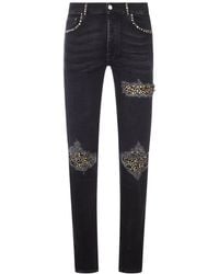 Amiri - Skinny Jeans With Studs And Destroy Details - Lyst