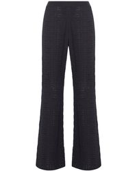 Givenchy - Pantaloni a zampa in jacquard 4g - Lyst