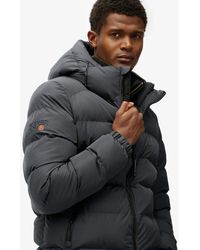 Superdry - & Co Gewatteerde Sportjas Met Capuchon - Lyst