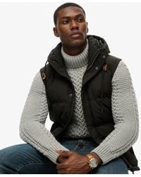 Superdry - Fully Lined Logo Embroidered Hooded Everest Puffer Gilet - Lyst