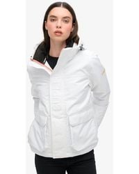 Superdry - Loose Fit Logo Embossed Hood Ultimate Windbreaker Jacket - Lyst
