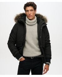 Superdry - Classic Embroidered Badge Hooded Everest Puffer Bomber Jacket - Lyst