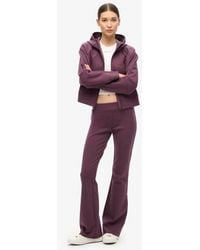 Superdry - & Co Sport Tech Low Rise Flared joggers - Lyst