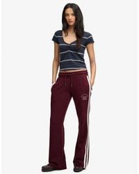 Superdry - & Co Athletic Essentials Stripe Flare joggers - Lyst