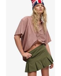 Superdry - Bench X & Co Bench Logo Pleated Peached Mini Skirt - Lyst