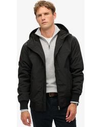 Superdry - Surplus Nylon Bomberjack Met Capuchon - Lyst