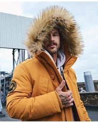 Superdry - Classic Embroidered Badge Everest Faux Fur Hooded Parka Coat - Lyst