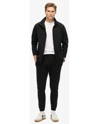 Superdry - & Co Tech Tapered jogger - Lyst