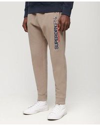 Superdry - Taps Toelopende joggingbroek Met Sportswear-logo - Lyst