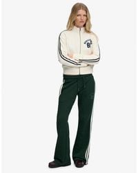 Superdry - & Co Athletic Essentials Stripe Flare joggers - Lyst