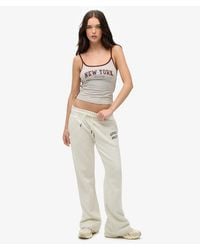 Superdry - & Co Athletic Essentials Low Rise Flare joggers - Lyst