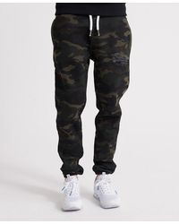 Superdry Pantalones de jogging de camuflaje con logo Vintage - Verde