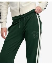 Superdry - & Co Athletic Essentials Stripe Flare joggers - Lyst
