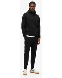 Superdry - & Co Tech Logo Tapered joggers - Lyst