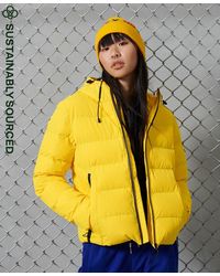 Plumíferos y chaquetas acolchadas en Amarillo de mujer | Lyst