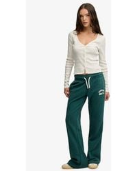 Superdry - & Co Embroidered Athletic Essentials Low Rise Flare joggers - Lyst