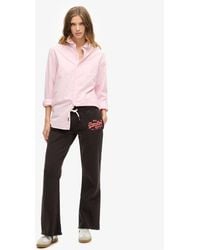 Superdry - Ladies Classic Embroidered Neon Vintage Logo Low Rise Flare joggers - Lyst