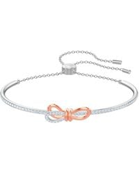 Swarovski - Lifelong Bow Bangle - Lyst