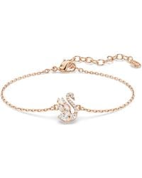 Swarovski - Rose-Tone Plated Swan Bracelet - Lyst