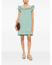 strapless open back dress ALINA PLEATED KNIT FIT AND FLARE MINI DRESS IN NAVY – AKIRA
