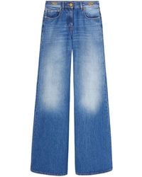 Versace - Flared Jeans Blu - Lyst