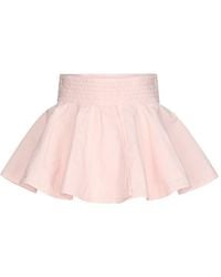 Alaïa - Peplum Denim Mini Skirt - Lyst