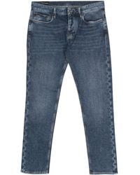 Emporio Armani - Jeans slim con placca logo - Lyst