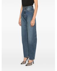Alaïa - Barrel-Leg Faded Denim Jeans - Lyst