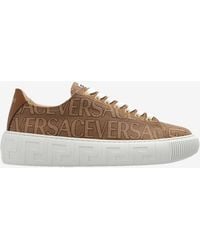 Versace - All-Over Logo Low-Top Sneakers - Lyst