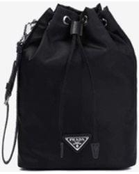 Prada - Logo Plaque Re-Nylon Bucket Bag - Lyst