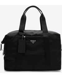 Prada - Triangle Logo Re-Nylon And Saffiano Leather Duffle Bag - Lyst