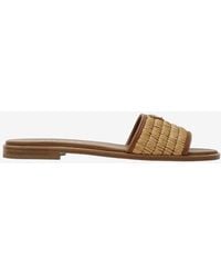 Prada - Triangle Logo Woven Strap Flat Sandals - Lyst