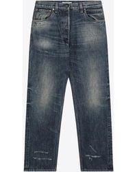 Prada - Logo Patch Distressed Faded Jeans - Lyst