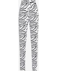Slacks and Chinos ROTATE BIRGER CHRISTENSEN Trousers Slacks and Chinos ROTATE BIRGER CHRISTENSEN Synthetic Elodie Zebra Print High-rise leggings in White Womens Trousers Blue 