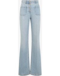 Valentino - Logo Patch Straight-Leg Washed Jeans - Lyst