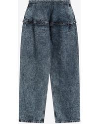 Alaïa - Peplum Stonewashed Jeans - Lyst