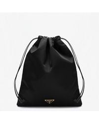 Prada - Triangle Logo Re-Nylon Drawstring Pouch Bag - Lyst