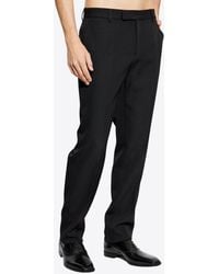 Versace - Tailored Wool Tapered Pants - Lyst
