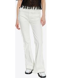 McQueen - Bootcut Denim Jeans With Raw Finish - Lyst